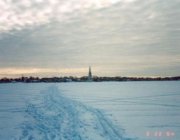 Вид на город и Колокольню Николаевского собора зимой с Монастырского острова